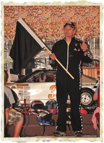 Pastor using Racing Flags to teach the Gospel during the week